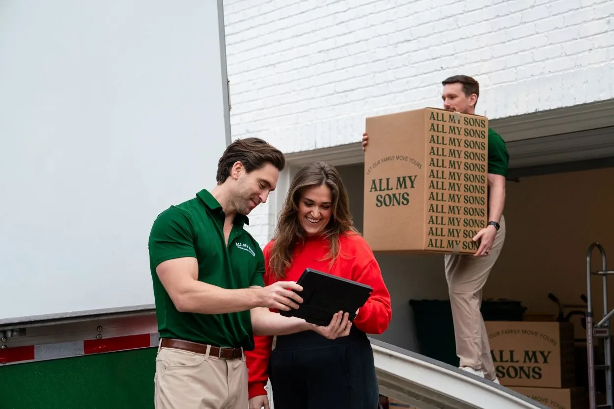 All My Sons movers help a customer understand their moving contract.