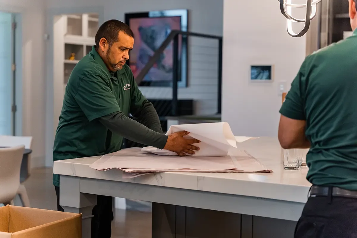 Professional packers with All My Sons Moving and Storage pack knives for a move.