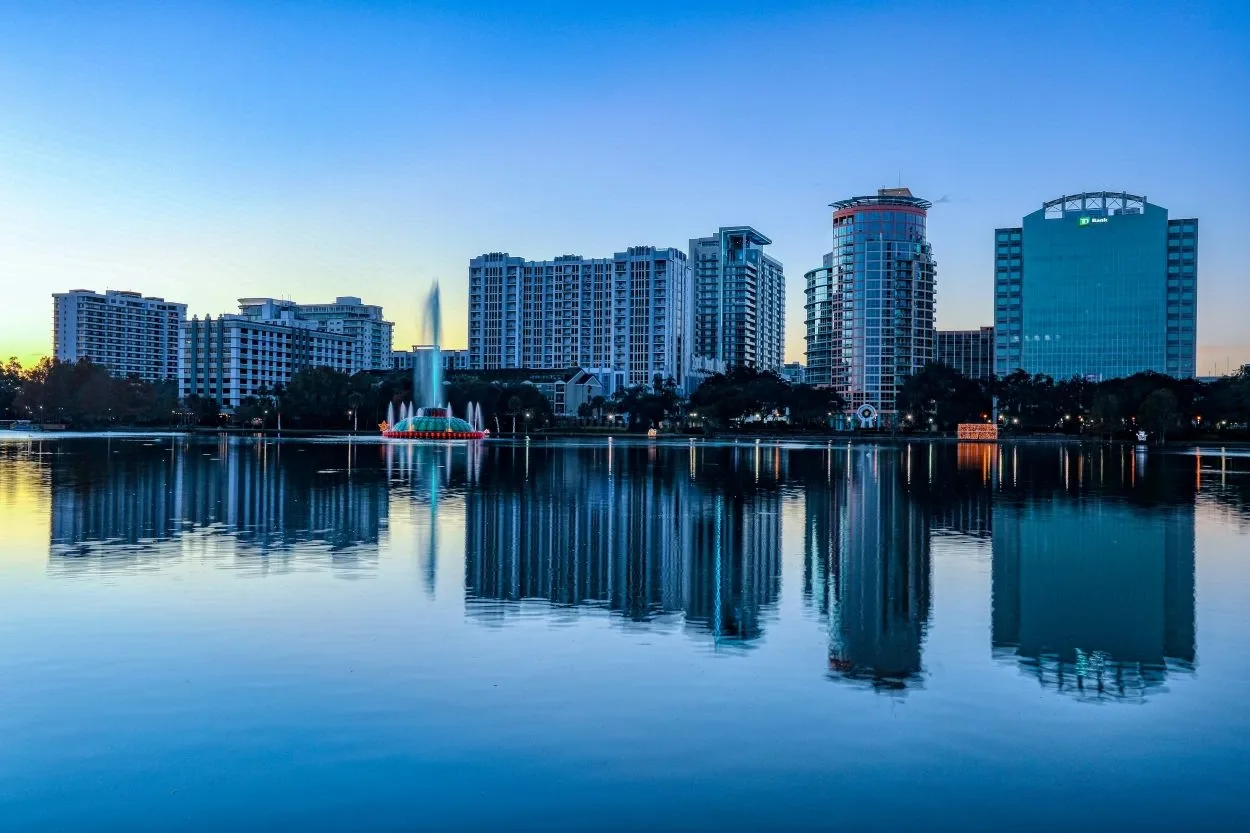 The view of the skyline from Lake Eola park in Orlando, FL. From Mick Haupt on Unsplash.