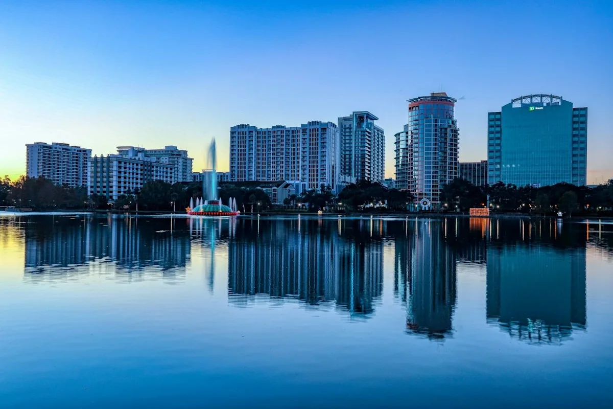 The view of the skyline from Lake Eola park in Orlando, FL. From Mick Haupt on Unsplash.