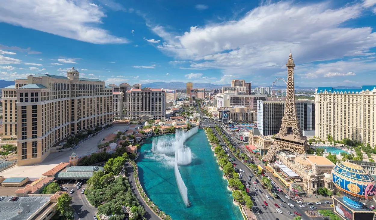An aerial view of the famous Las Vegas strip including the Fountains of Bellagio and the prominent Paris Las Vegas Hotel & Casino.
