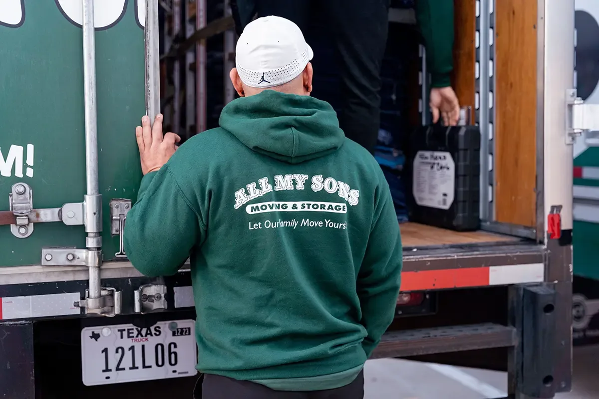 All My Sons professional movers check the back of a moving truck before a household move.