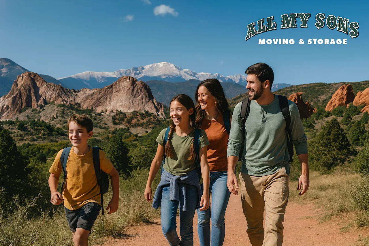 A happy family hiking in Colorado Springs with Pikes Peak in the background, embodying new beginnings. All My Sons: Your trusted local movers.