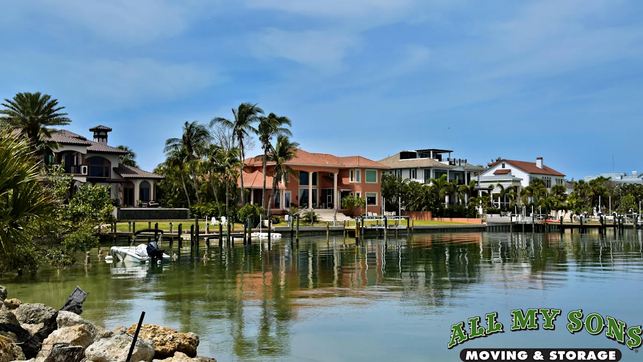Luxury waterfront estates with private docks along Sarasota Bay, illustrating the high-end residential moving capabilities of All My Sons Moving & Storage.