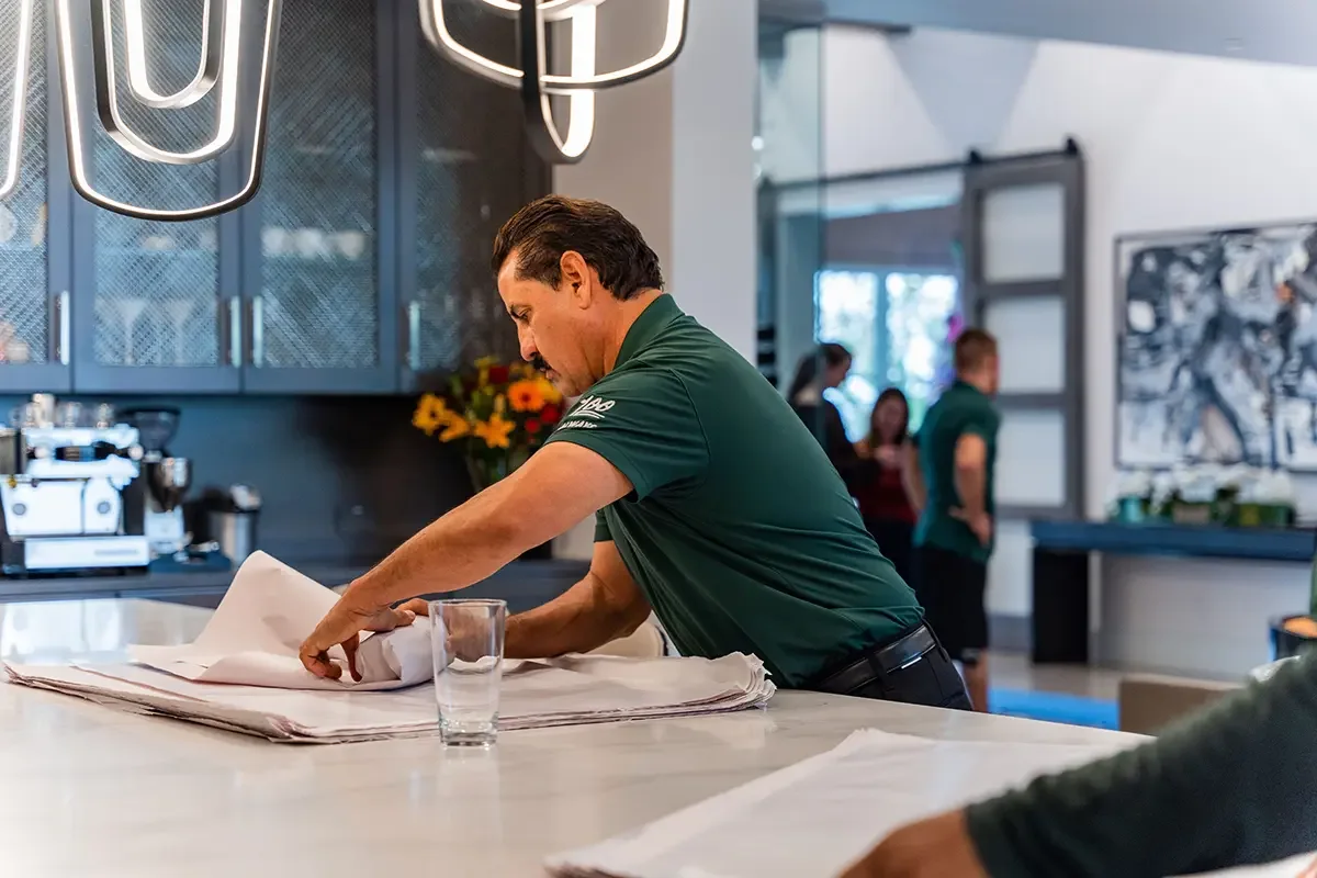 All My Sons professional packers wrap glassware for moving.