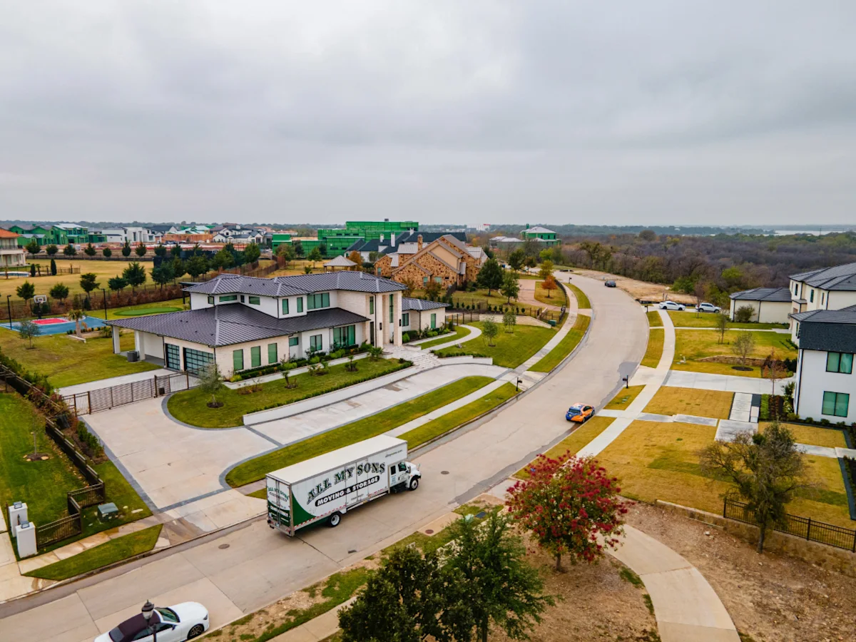 Professional movers from All My Sons arrive at newly purchased home to perform a residential move.
