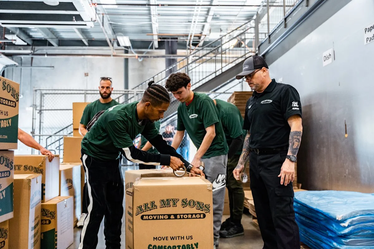 Professional movers from All My Sons Moving and Storage start packing an office space up for a move.