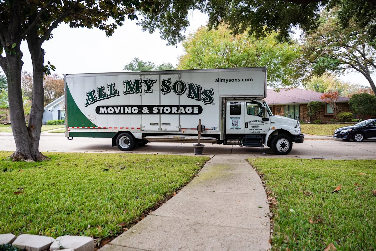 An All My Sons moving truck arrives in a suburban neighborhood to perform a move.