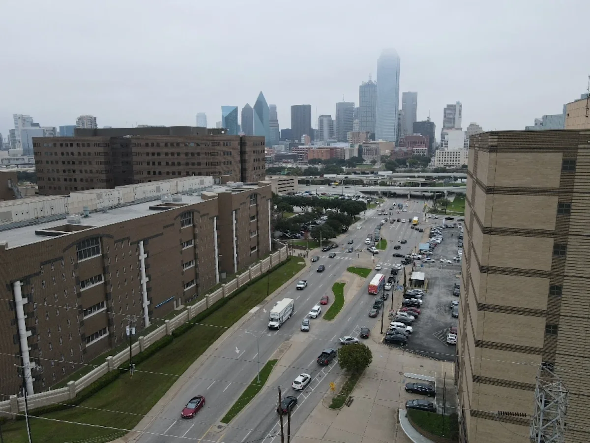 The Dallas, TX skyline featuring an All My Sons Moving Truck on a move.