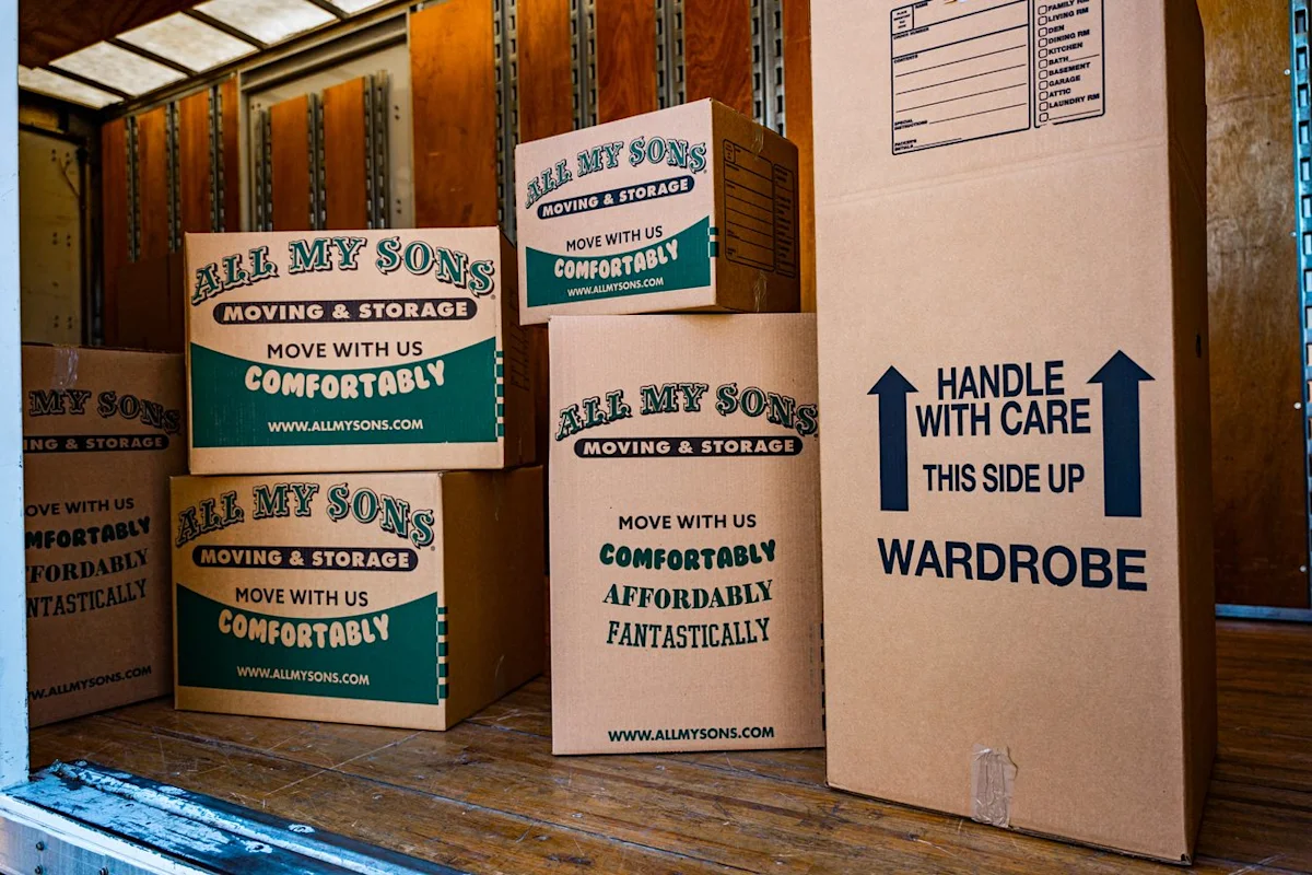 All My Sons Moving and Storage boxes packed into a moving truck.