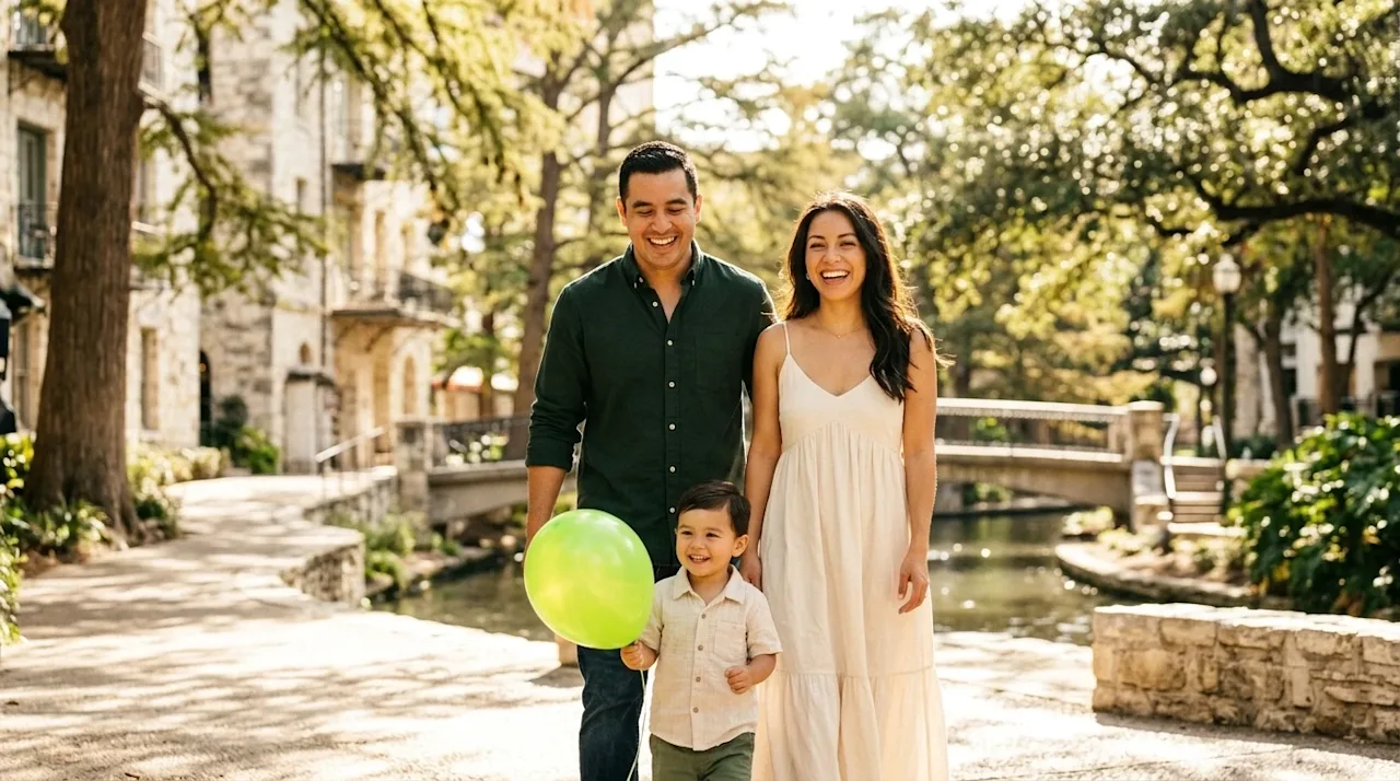 Professional lifestyle marketing photography of a joyful family of three—a mother, father, and young child—smiling and walkin