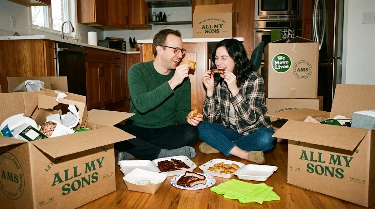 A candid, 35mm film photograph of a happy couple sitting on the floor of their new kitchen, excitedly eating a takeout feast