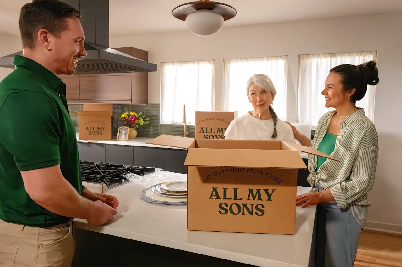 All My Sons team member assists senior woman with move.