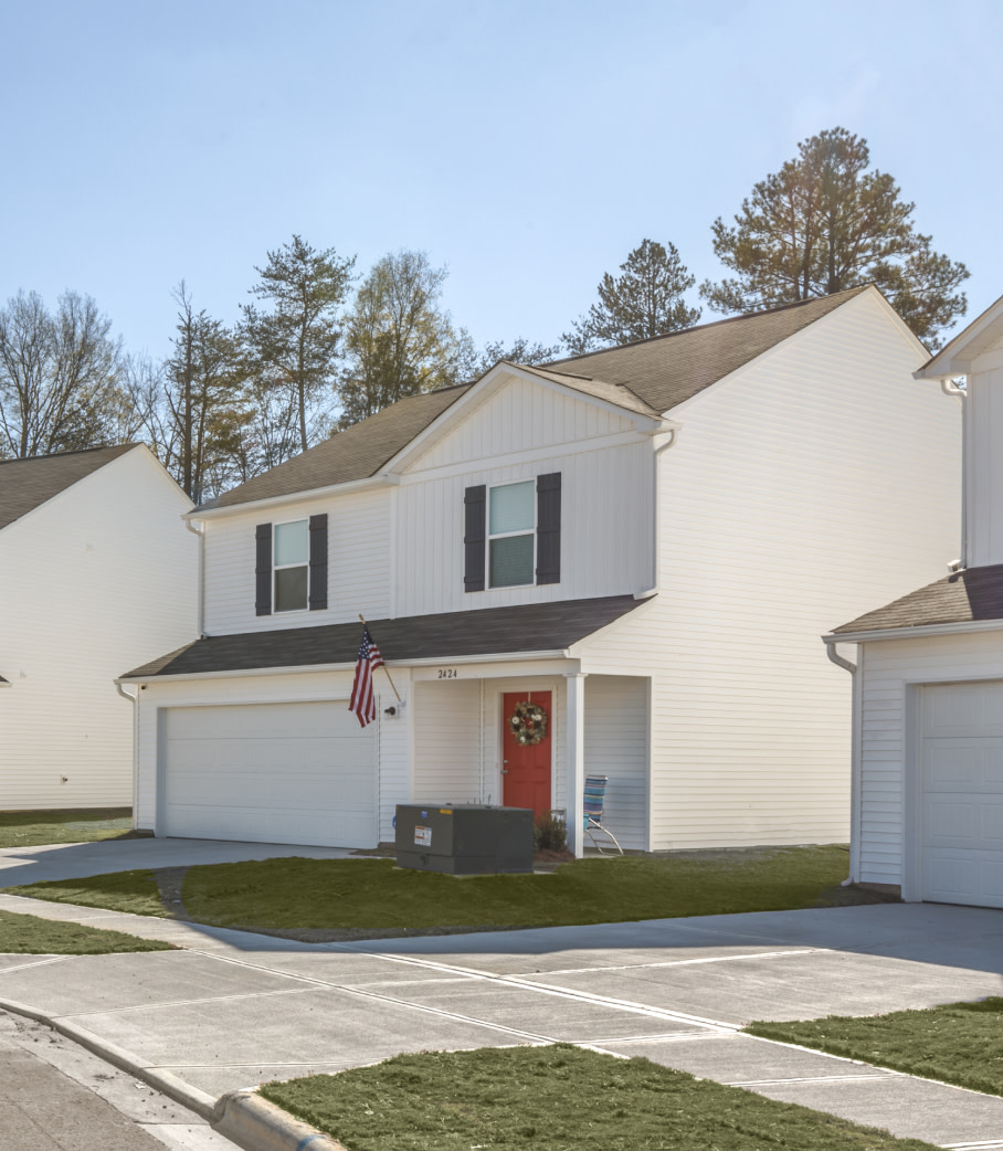 single family home with a red door