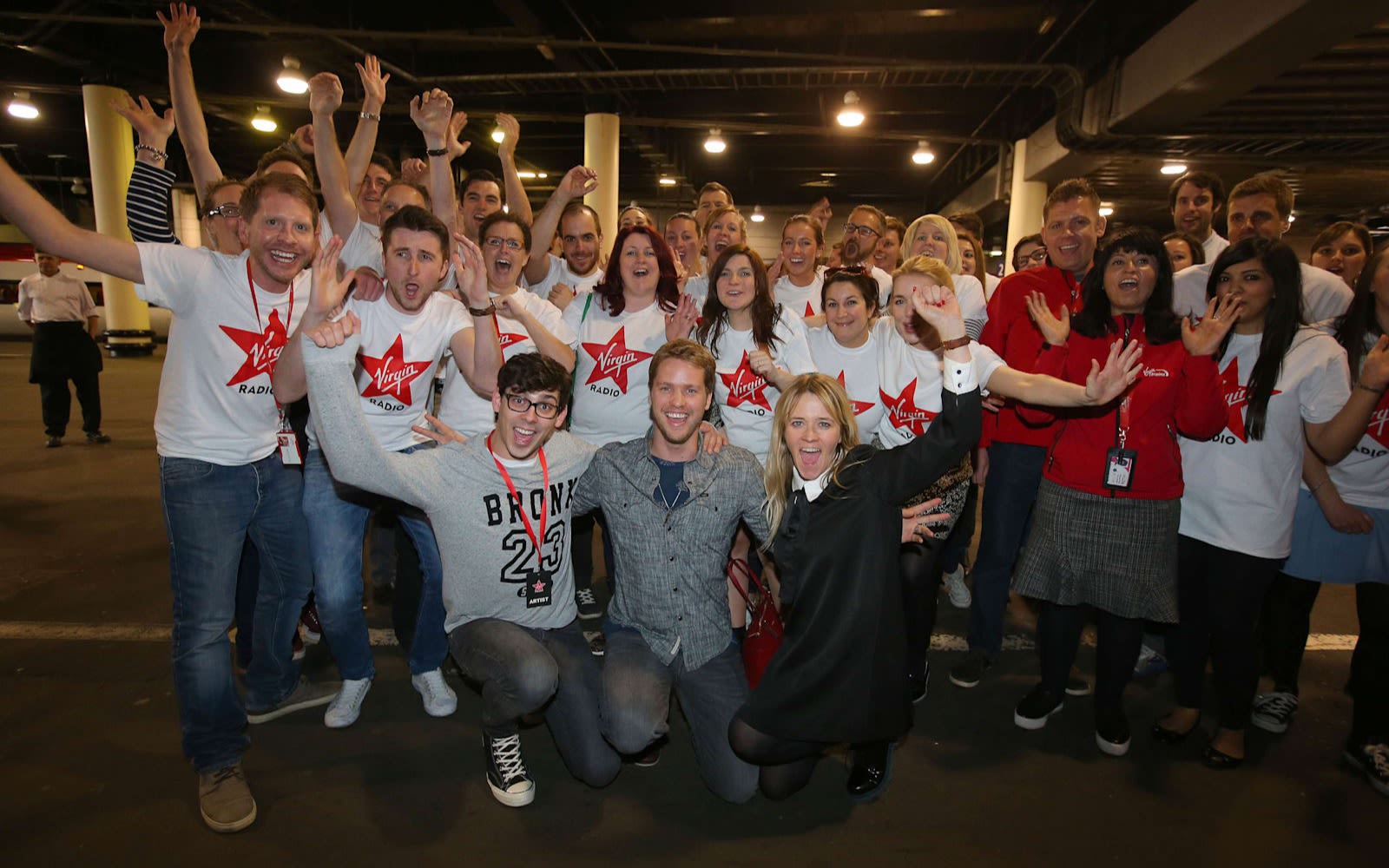 Sam Branson posing with Virgin Radio UK employees