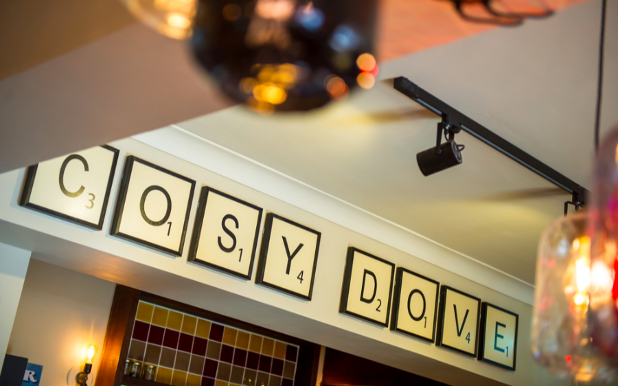 Image of Scrabble style sign spelling 'Cosy Dove'.