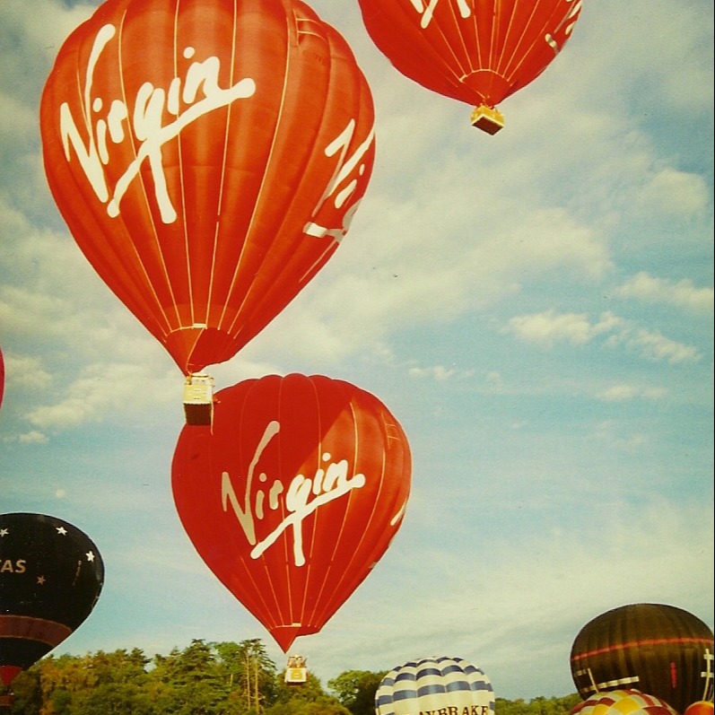 Three Virgin balloons taking to the sky at the Bristol Balloon Fiesta 