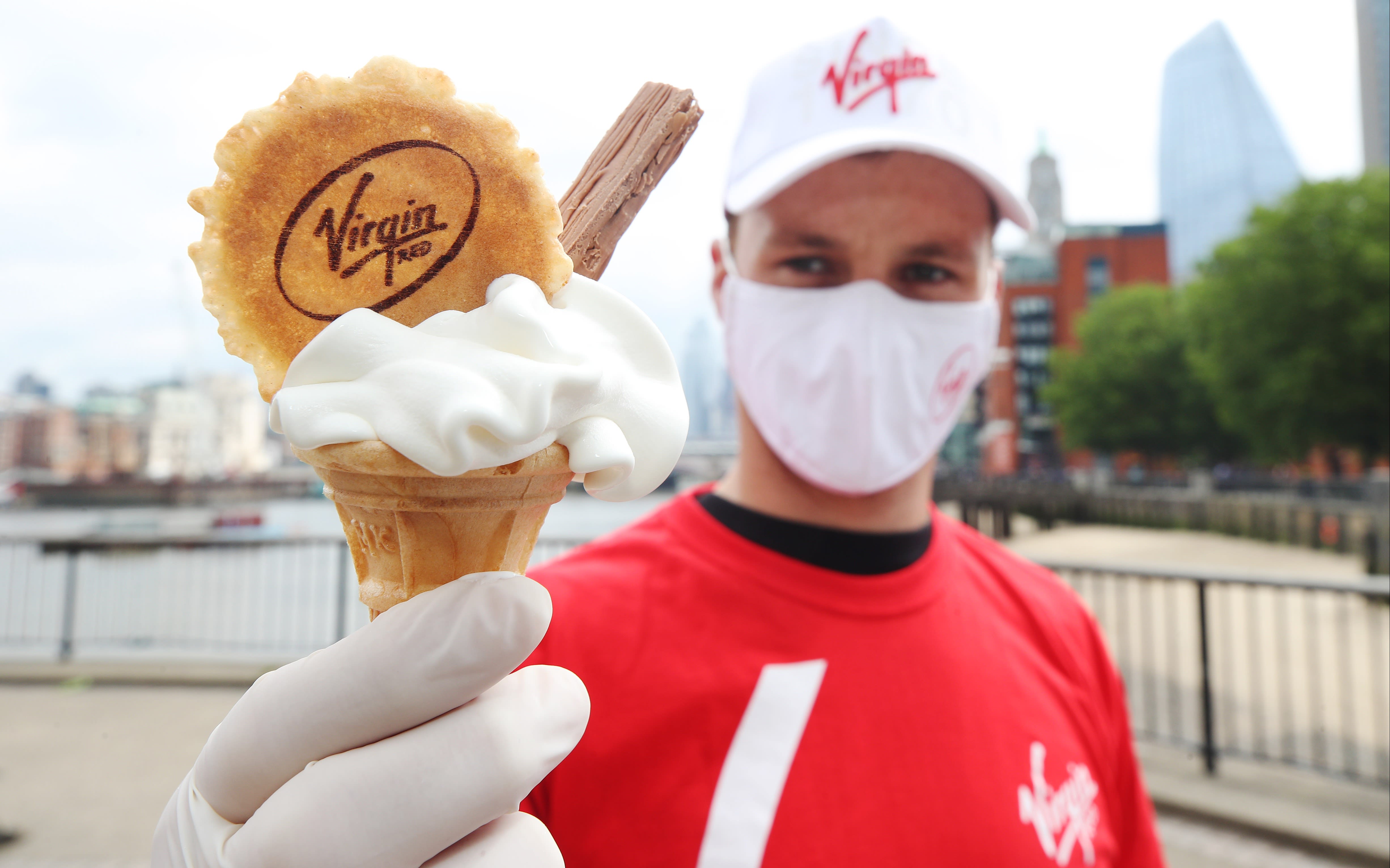 Virgin Red brand ambassador serving an ice cream cone with wafer