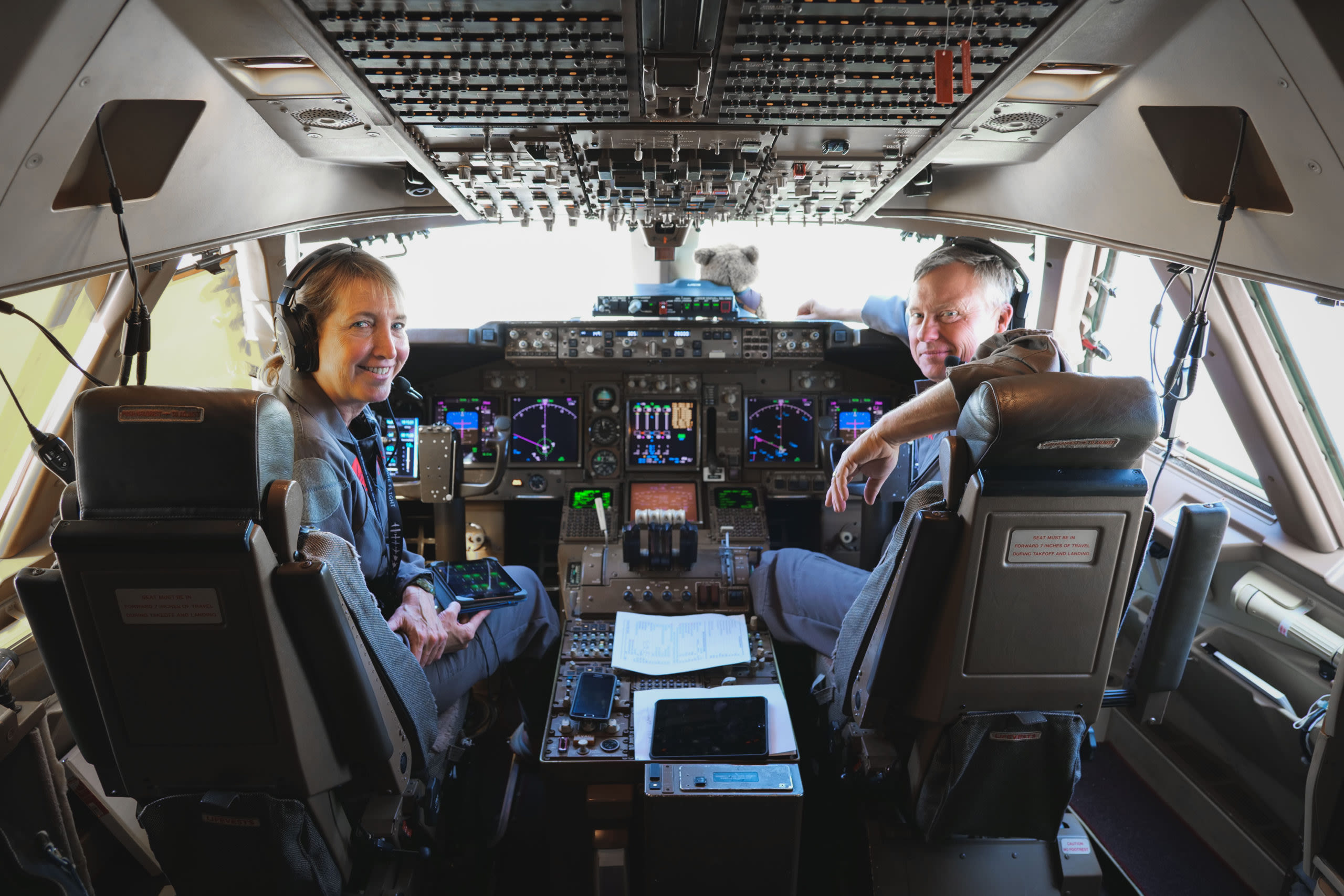 Virgin Orbit pilots smile from the flight deck on Cosmic Girl