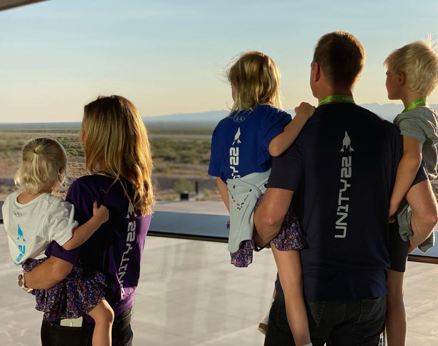 Holly Branson and Freddie Andrewes looking out over Spaceport America ahead of Virgin Galactic's Unity 22 spacelfiht with Richard Branson