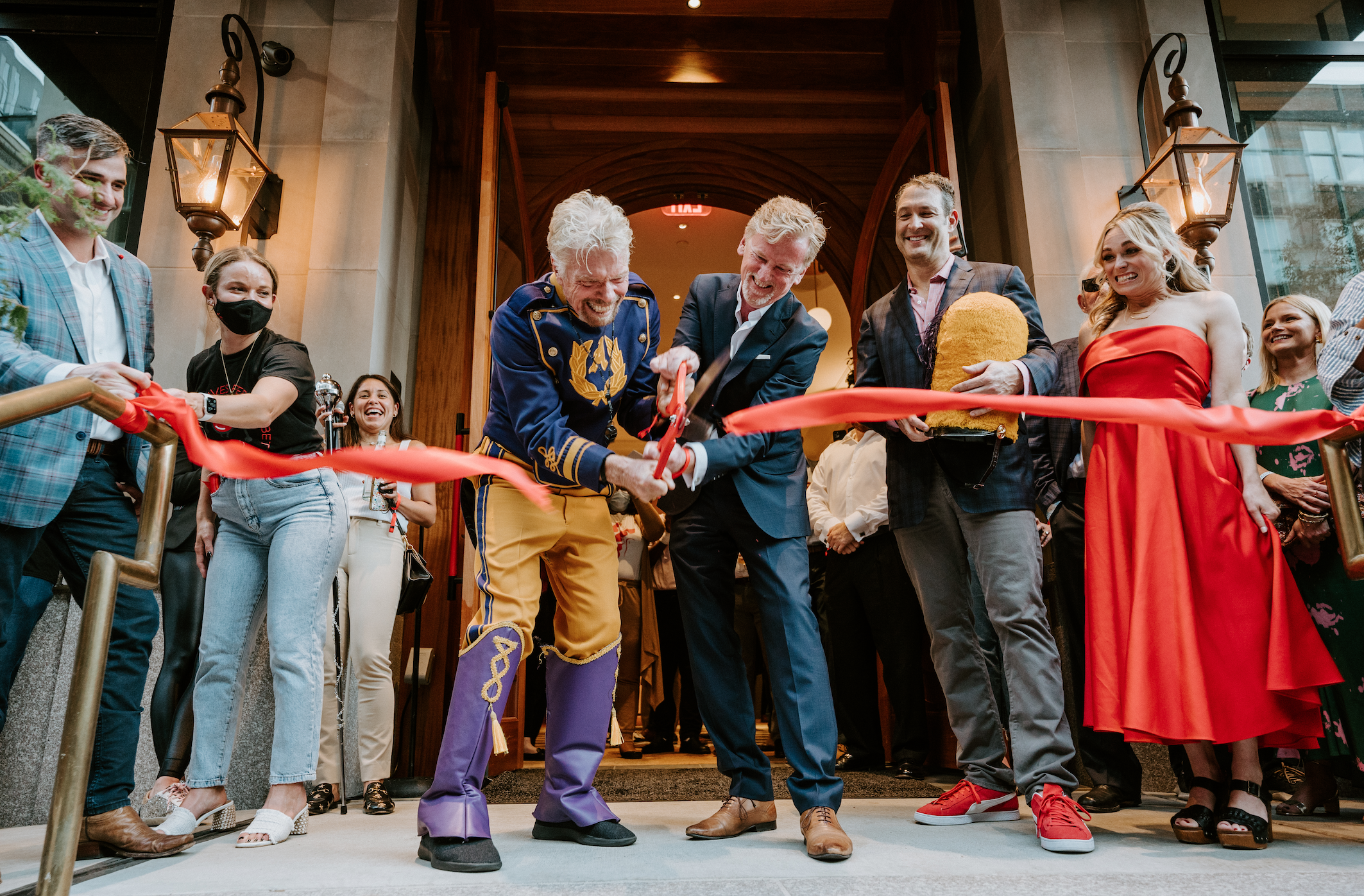 Richard Bransoncuts the opening ribbon of Virgin Hotels New Orleans