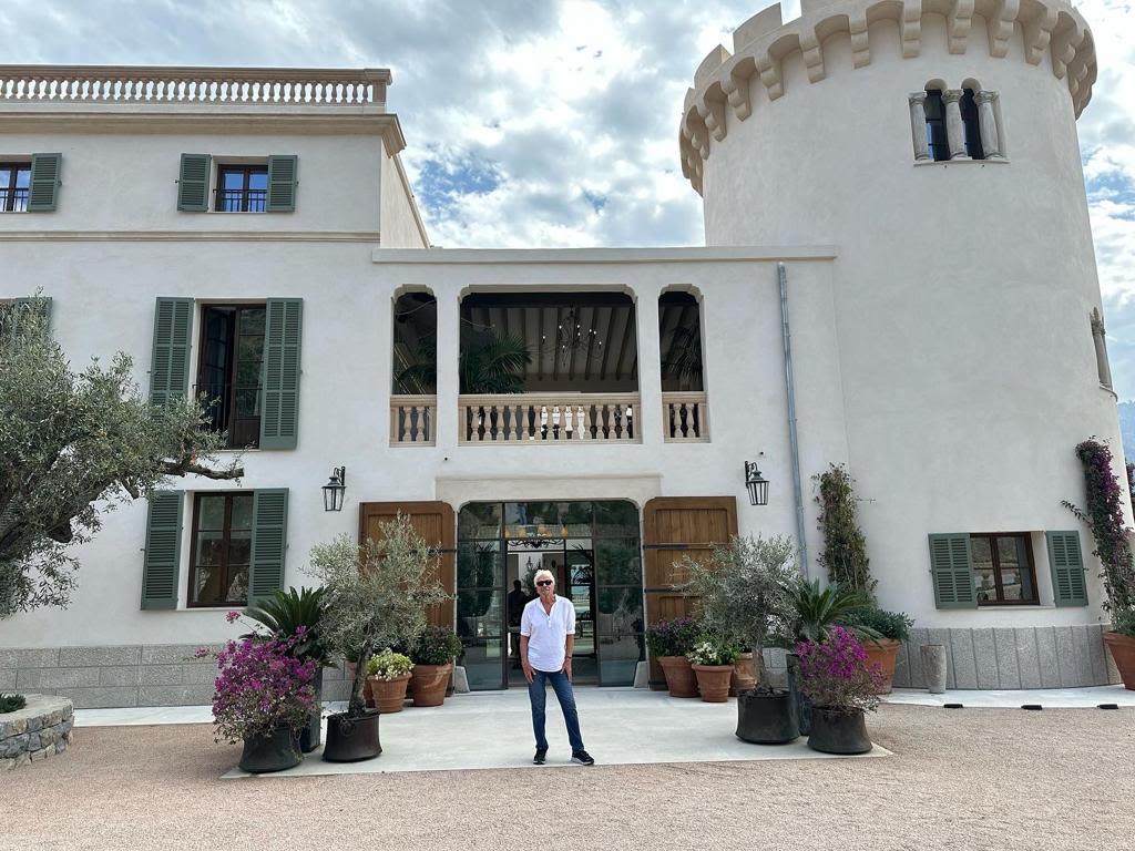 Richard Branson standing outside Son Bunyola hotel in Mallorca