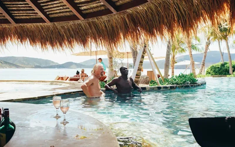 Richard Branson at a swim up bar