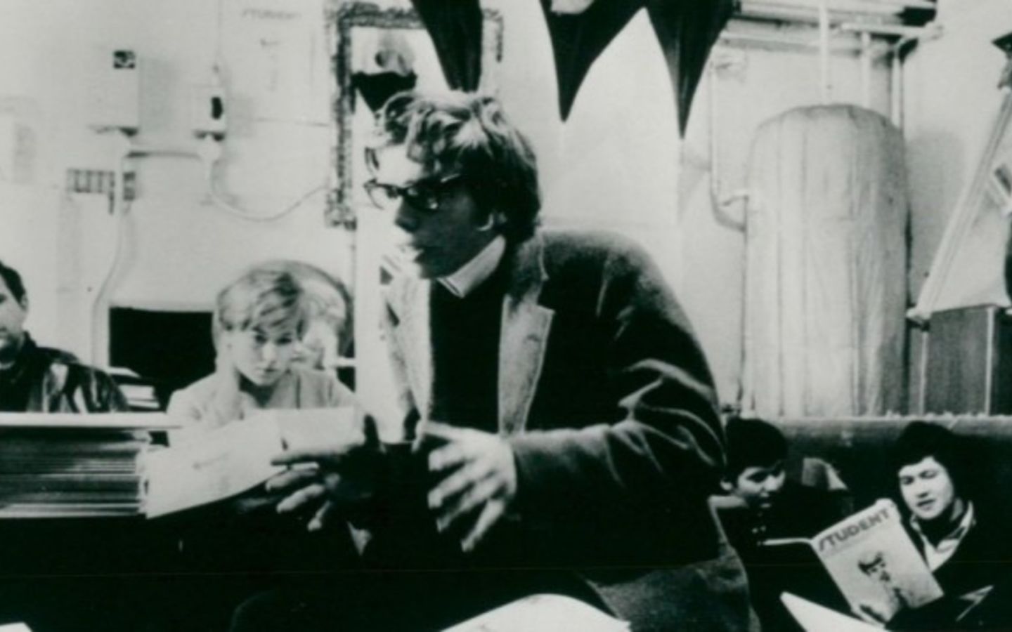 A very young Richard Branson speaking to his fellow colleagues 