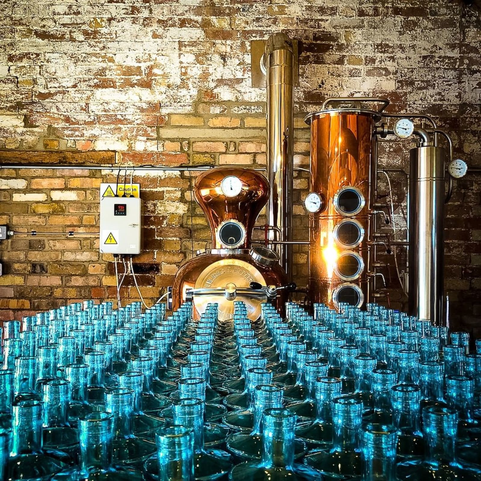 Image from the Roundwood Gin distillery with blue gin bottles