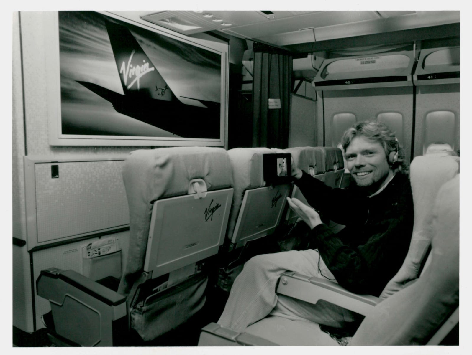 Richard Branson on a Virgin Atlantic plane with the first seatback entertainment screen