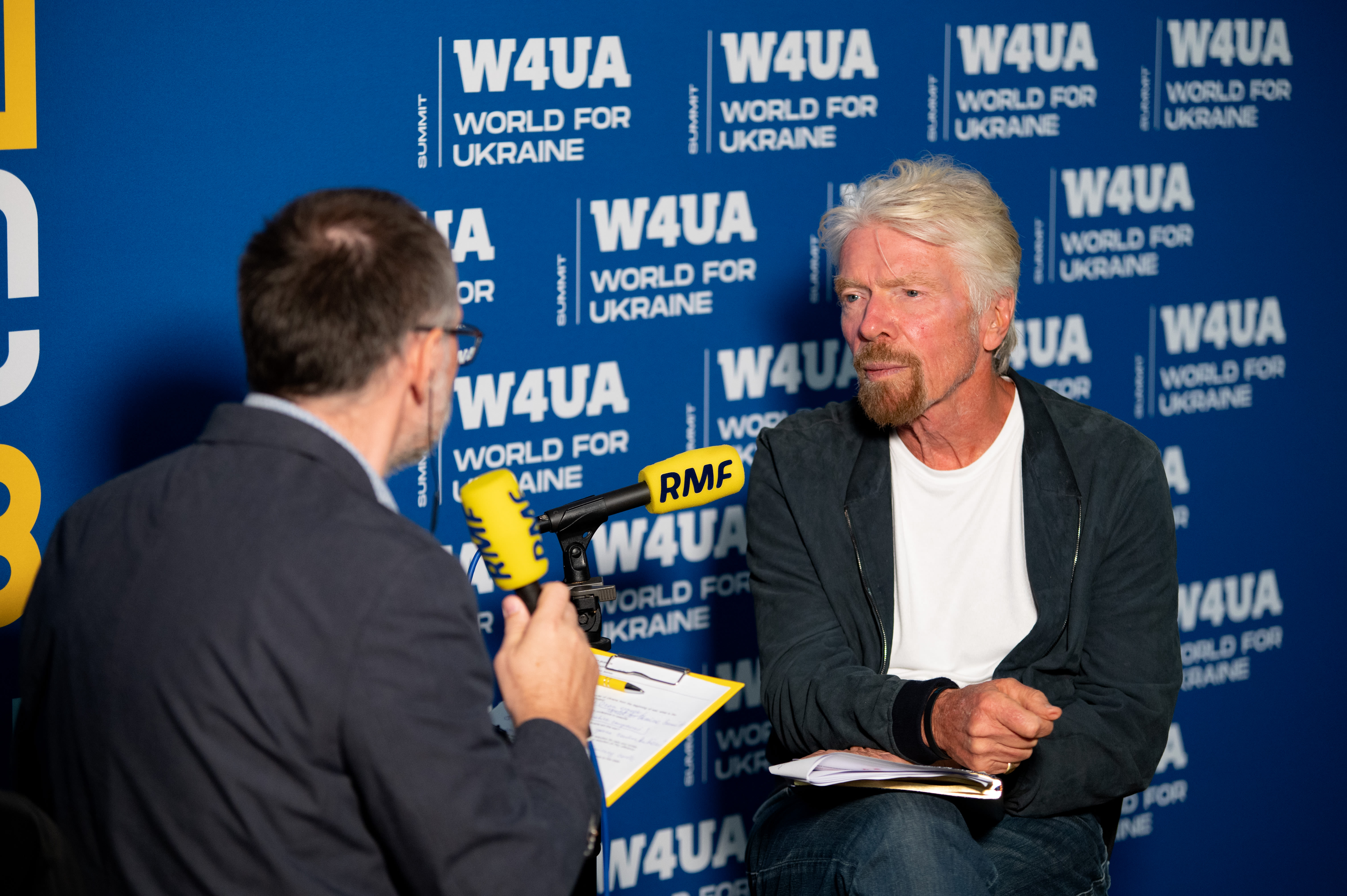 Richard Branson in Poland discussing Ukraine