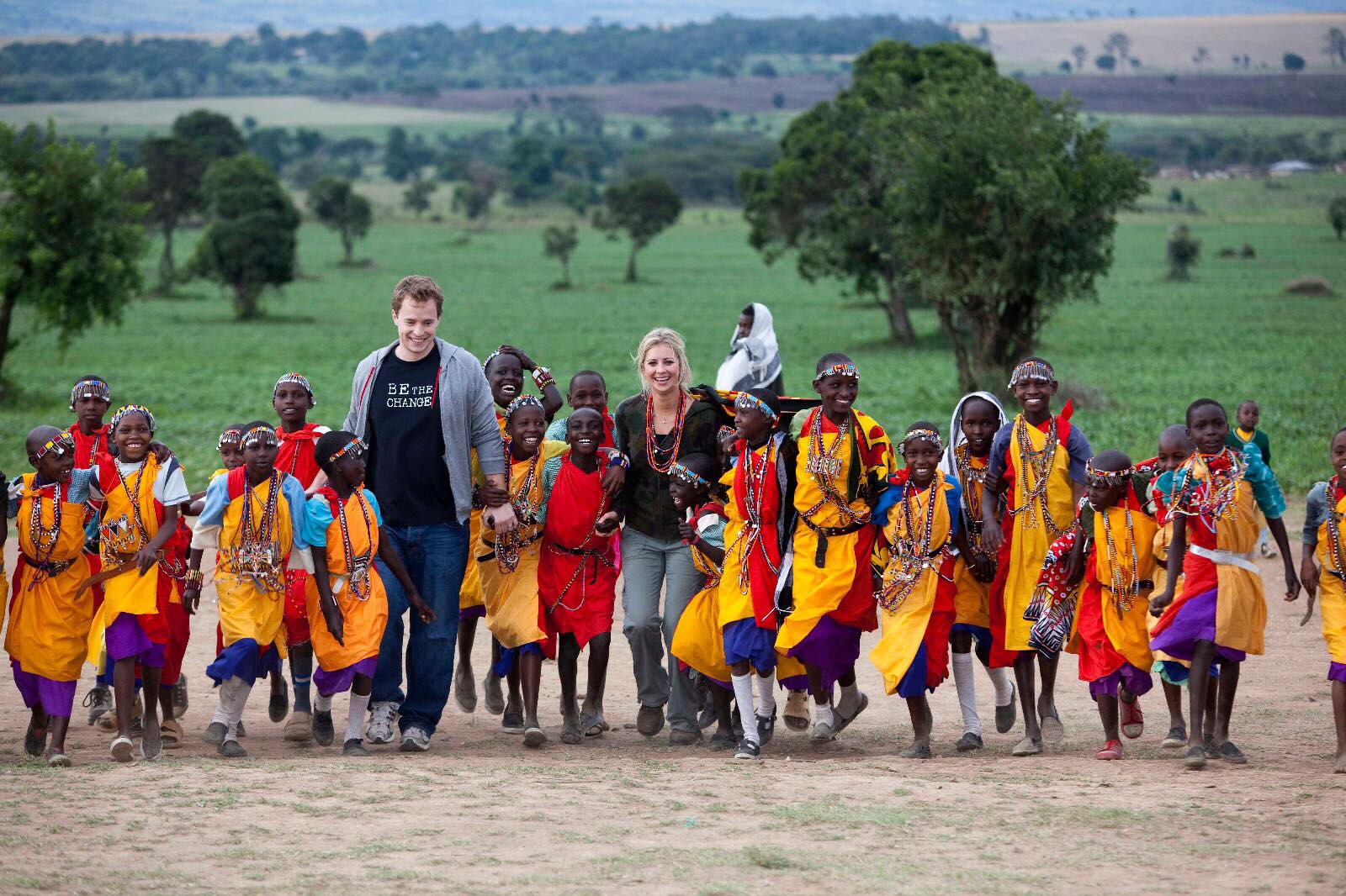 Holly Branson in Kenya walking with children from the Maasai Mara