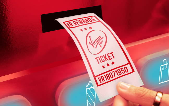 A woman holding a Virgin Red rewards ticket