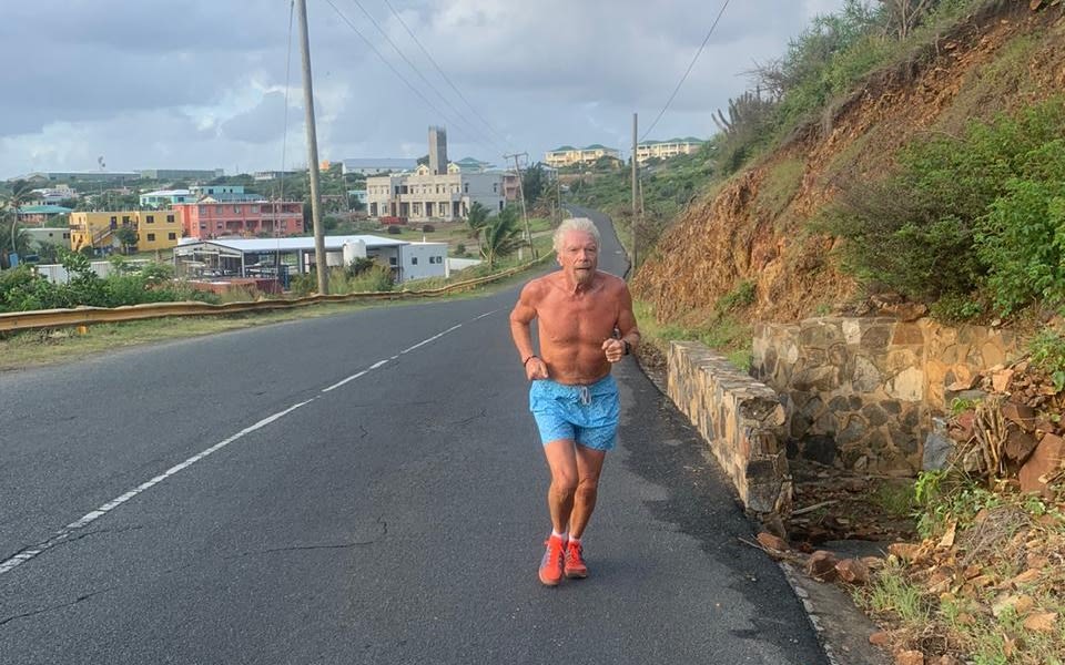 Richard Branson running up a hill