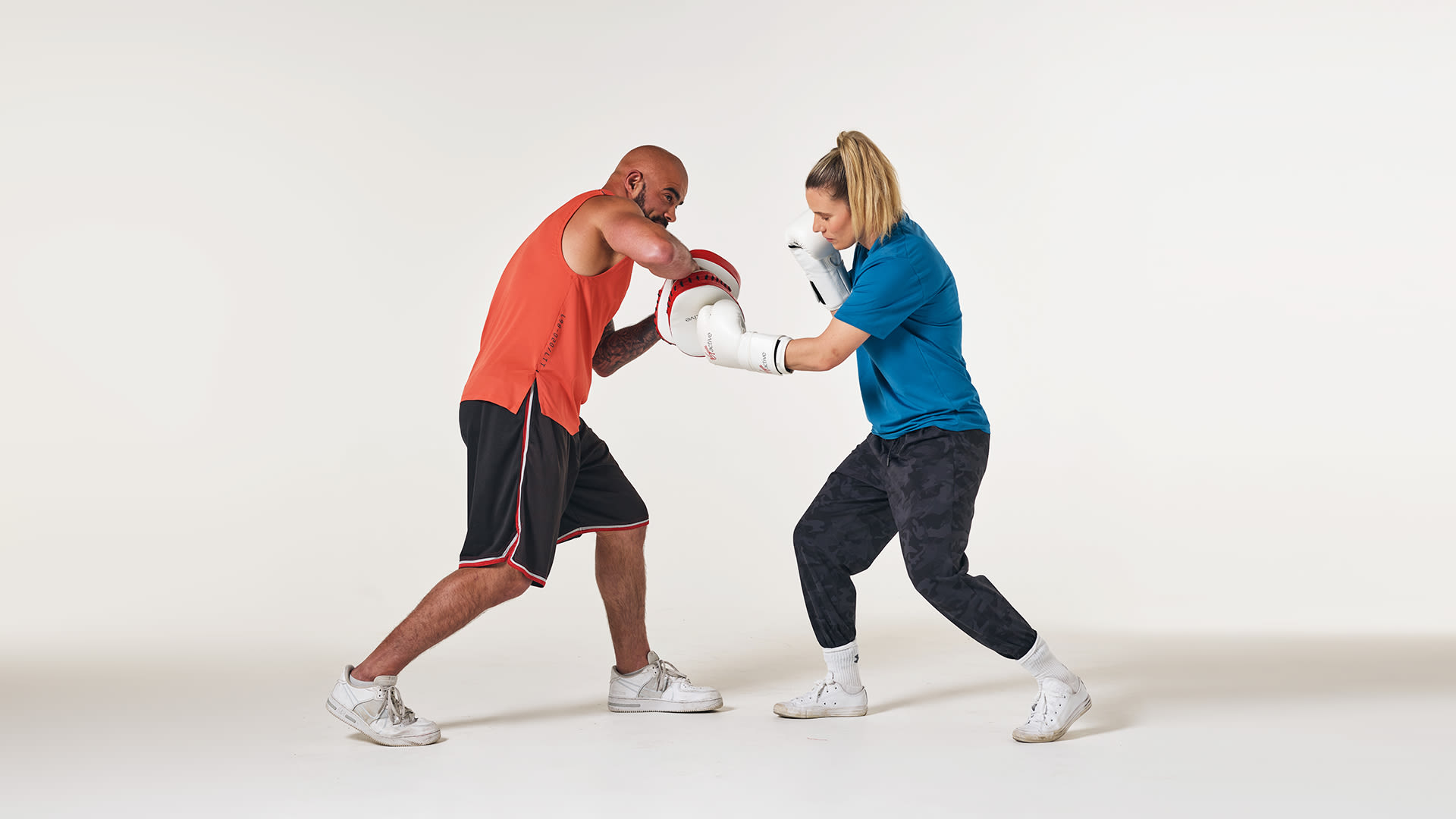 A man and a woman boxing