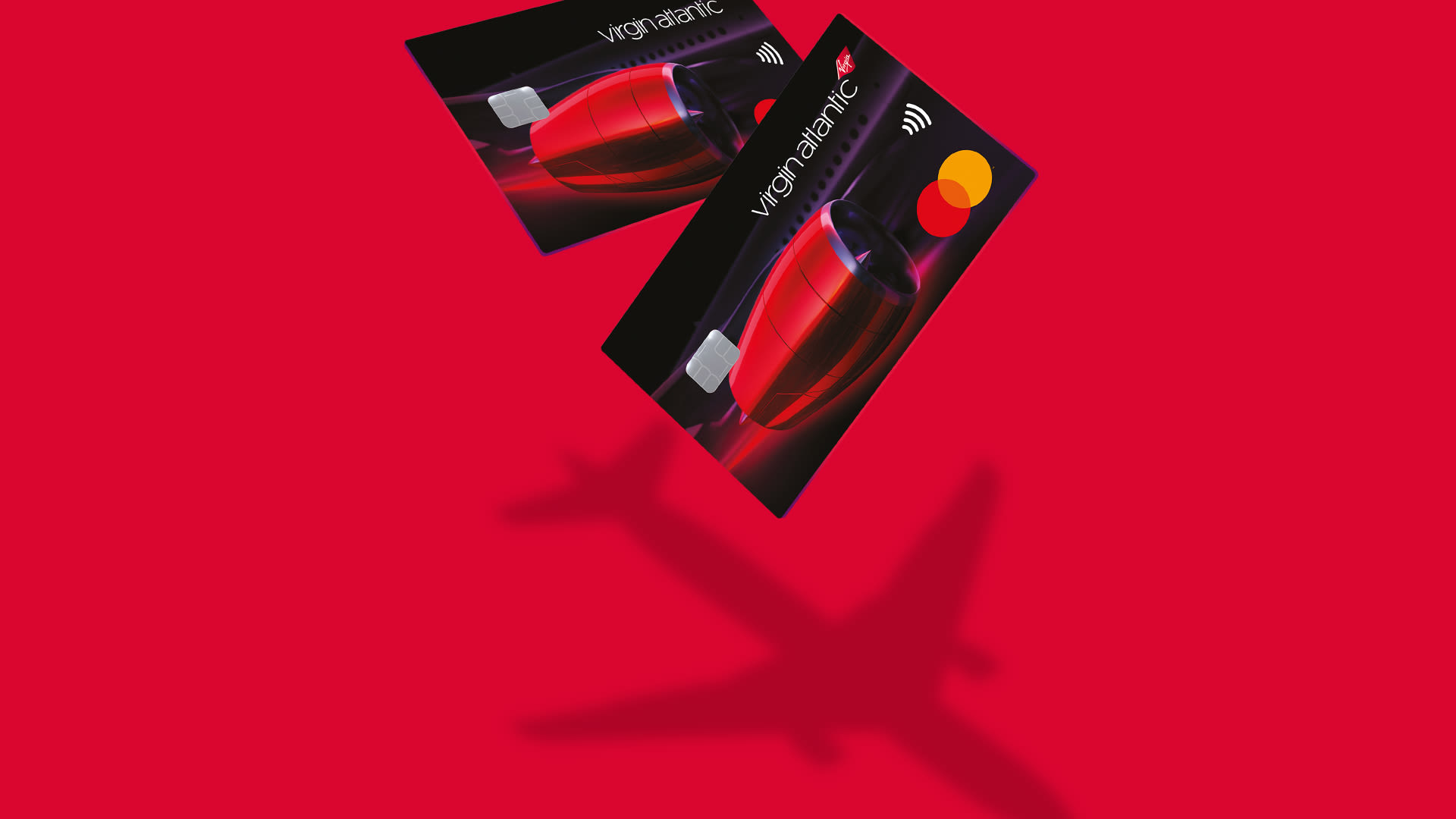 Image of Virgin Atlantic Reward + Credit Card with the shadow of two Virgin Atlantic aircrafts.