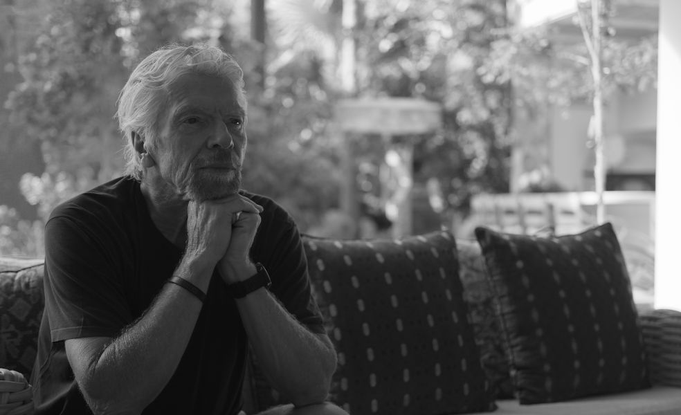 Richard Branson sitting at his home on Necker Island