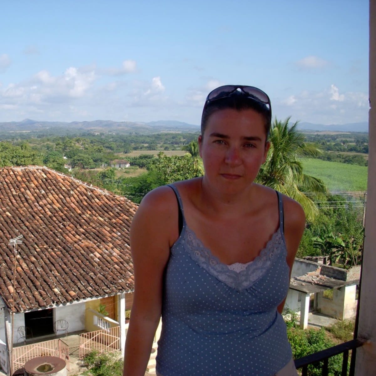 Anna Gowdridge the Human At Work Director for Virgin Unite posing on a balcony