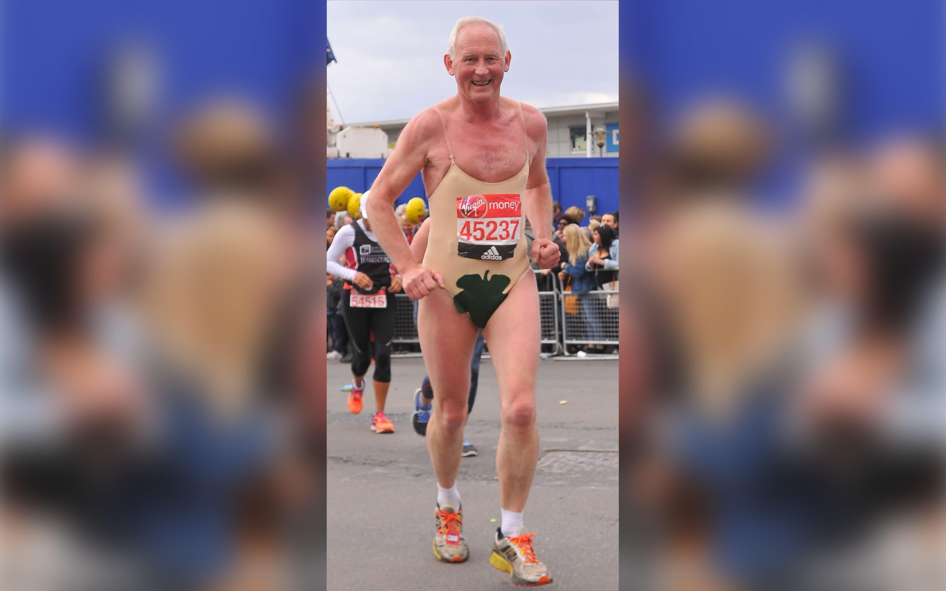 Bob Deacon wearing a skin coloured leotard with a leaf over the crotch running the Virgin Money London Marathon