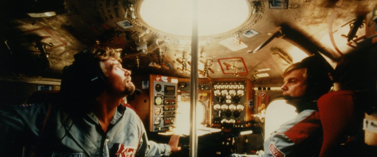 Richard Branson inside hot air balloon with pilot