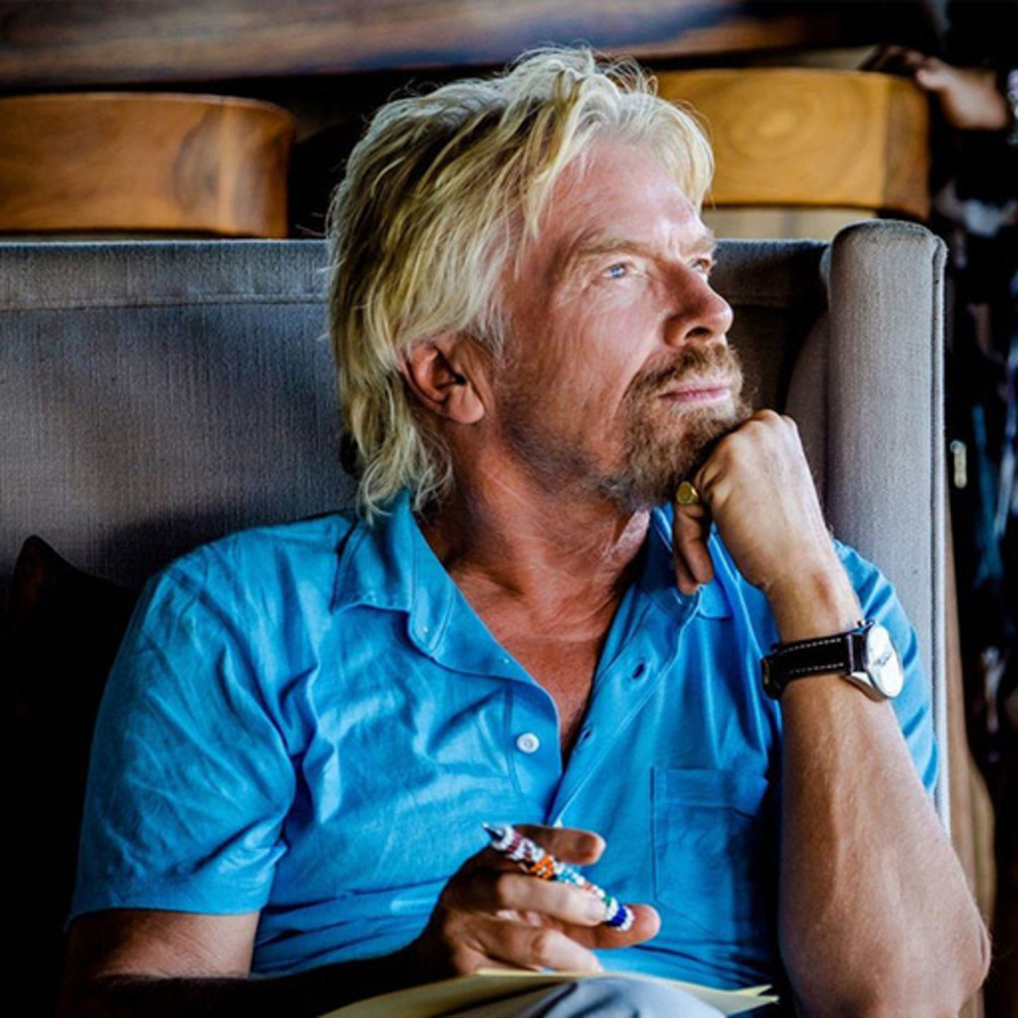 Richard Branson sitting down looking pensive