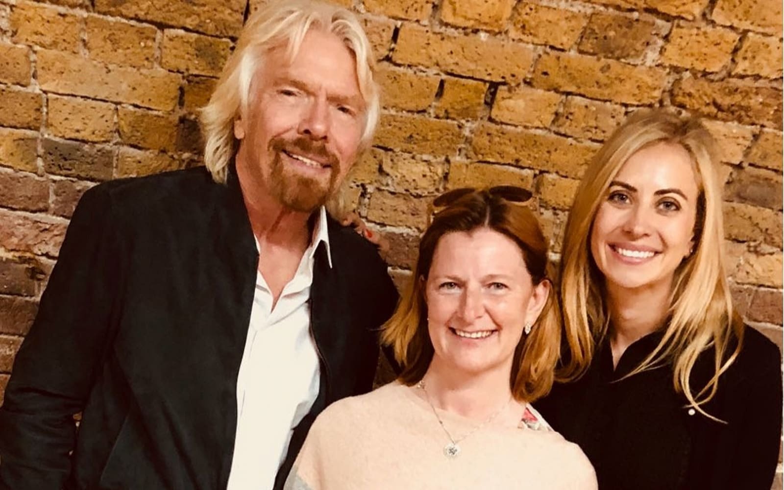 Richard Branson and Holly Branson with the winner of the VOOM Unite Impact Award 2018