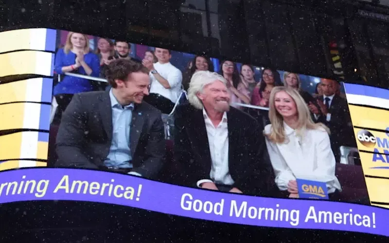 Richard Branson, Holly Branson and Craig Kielburger on screen on Good Morning America show