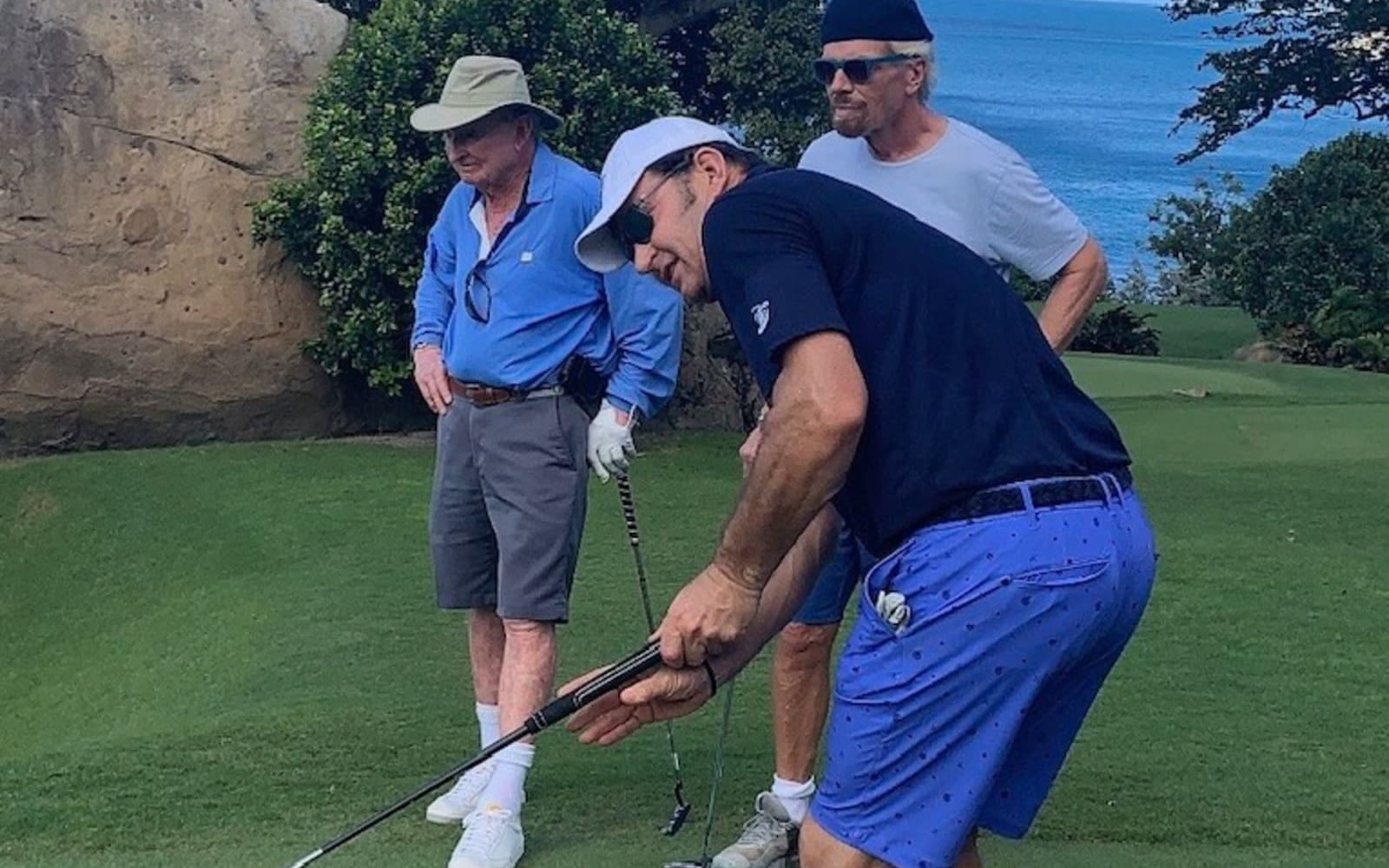 Richard Branson playing golf with Nick Faldo and Rod Laver