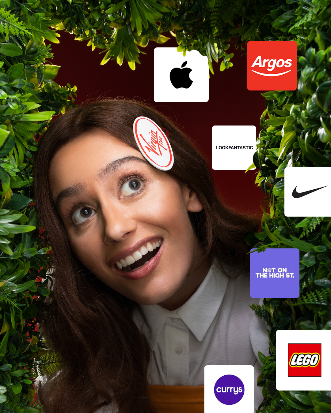 Image of a lady staring through a leafy door at some logos.