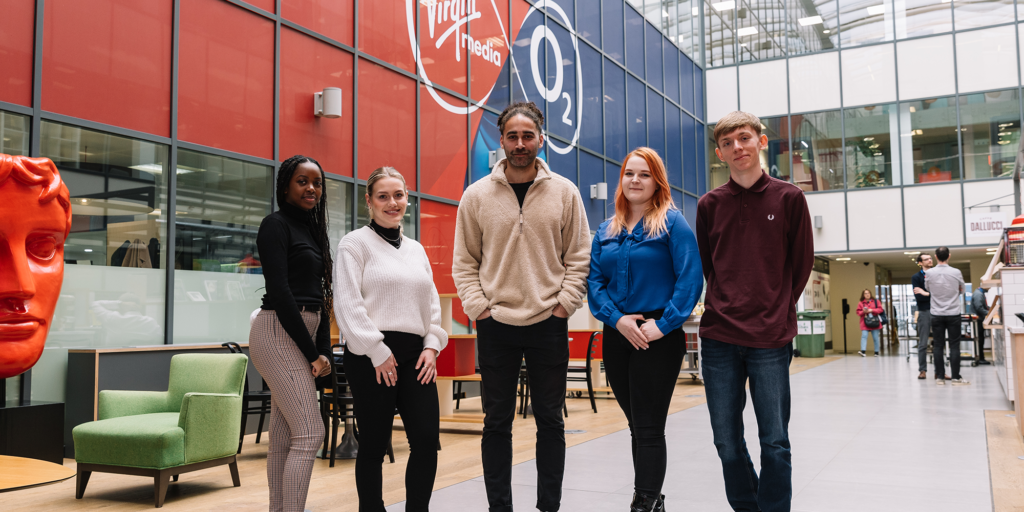 Five Virgin Media O2 apprentices pose for a photo at the Virgin Media O2 office