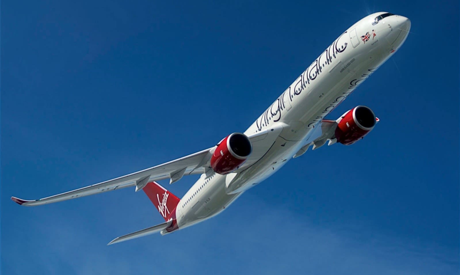 A Virgin Aircraft in flight through blue skies