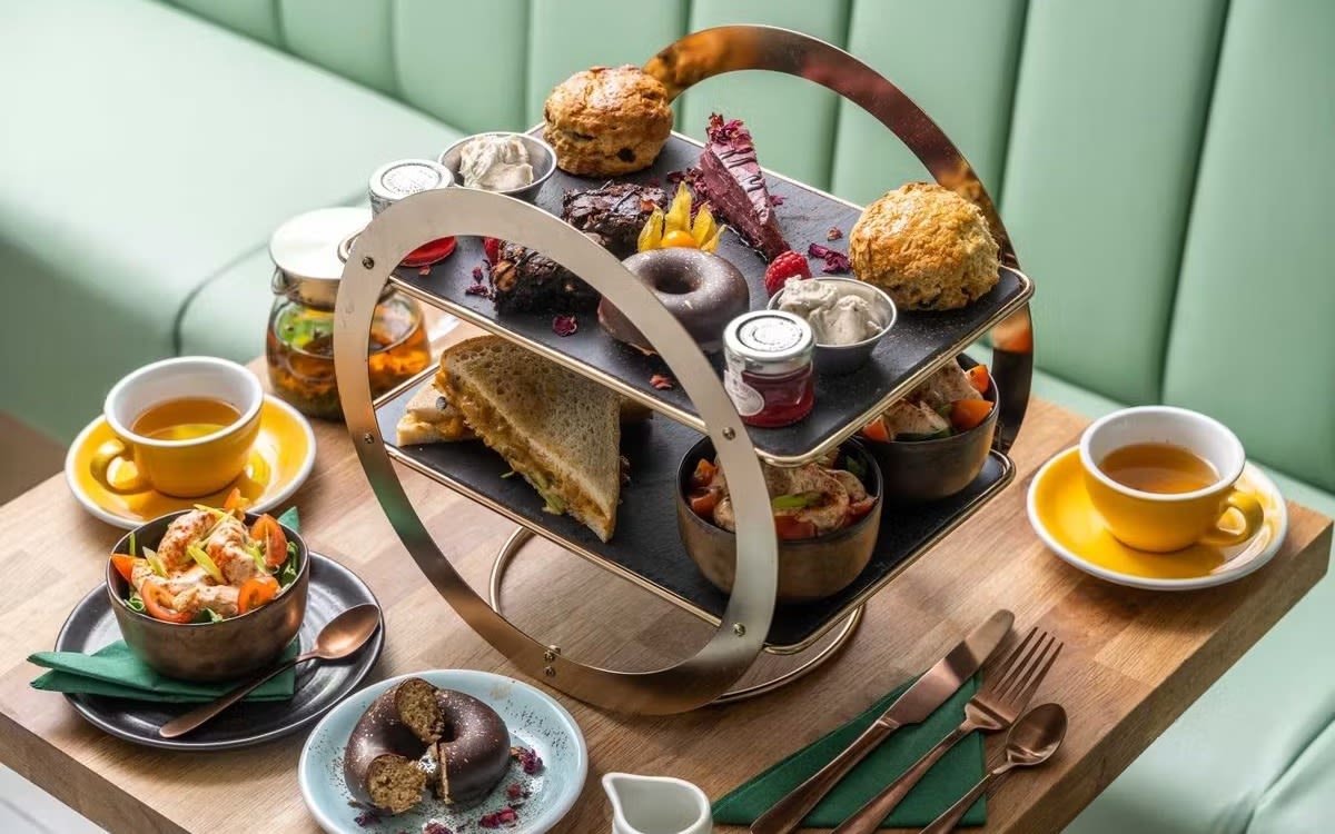 An image showing the spread of a vegan afternoon tea served in Eden Café