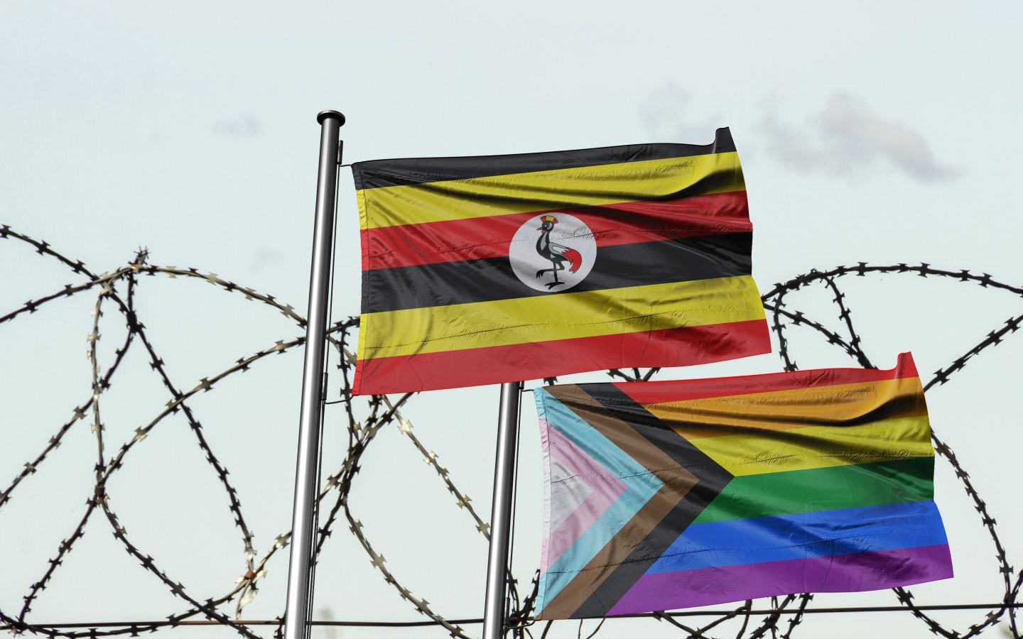 The flag of Uganda and a Pride flag