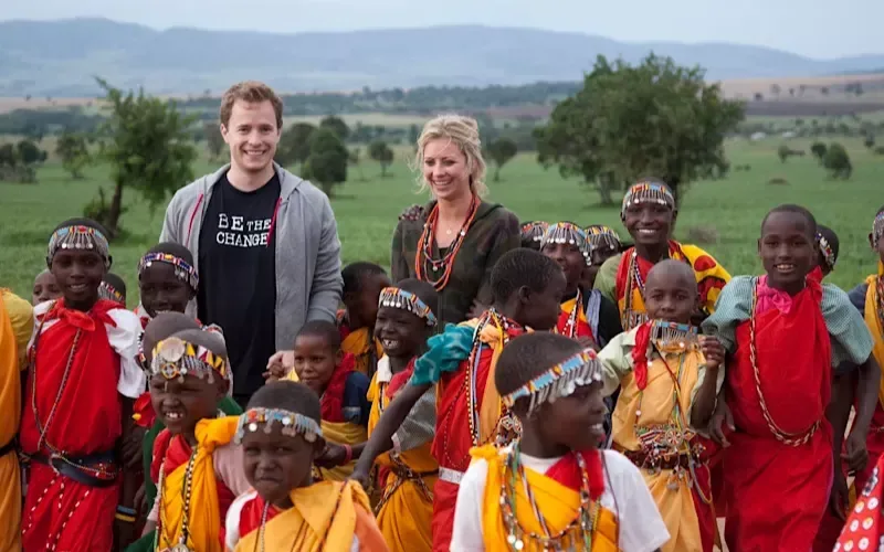 Holly Branson in Kenya surrounded by Kenyan children